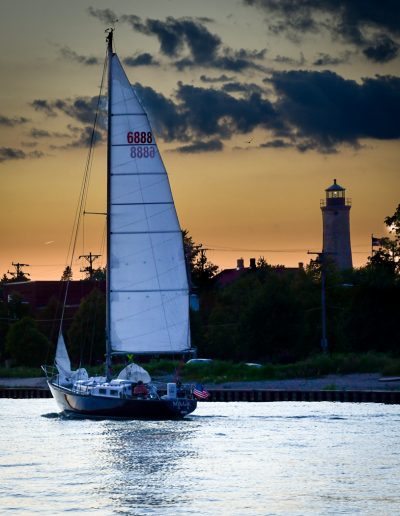 AugKenoshaSue BaronSailing and the Lighthouse in Distan